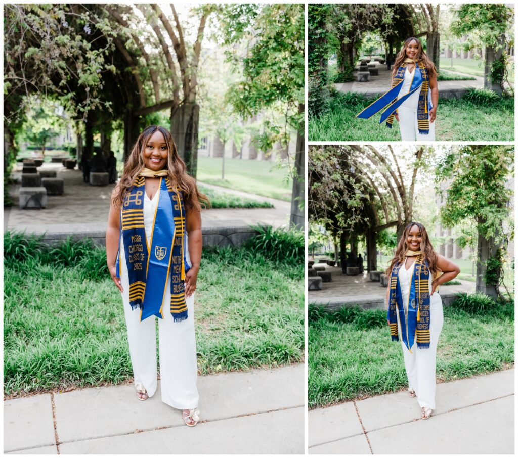 Njeri standing on the University of Notre Dame campus in soft evening light after earning her master’s degree.