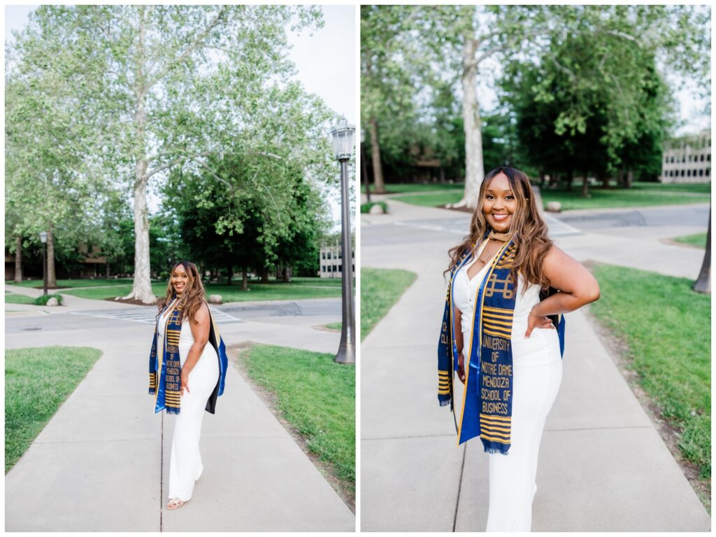 Full length and slightly zoomed in portrait of a graduate on the University of Notre Dame campus in soft evening light after earning her master’s degree.