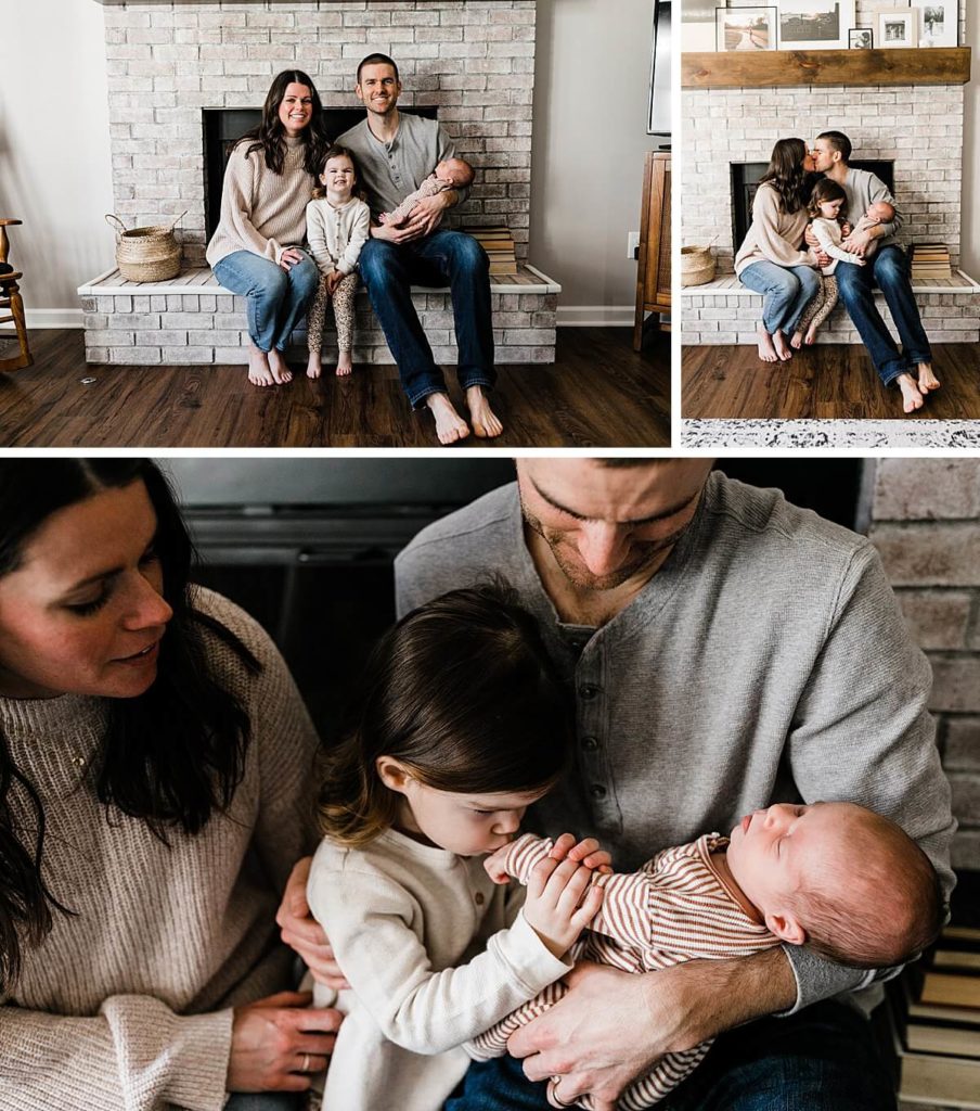Family sits in front of fireplace during in-home newborn photography session in Carmel Indiana